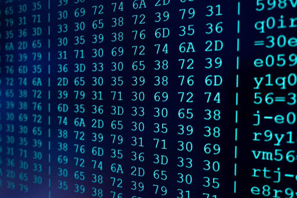 Program HEX code on scientific device screen, green text ASCI information